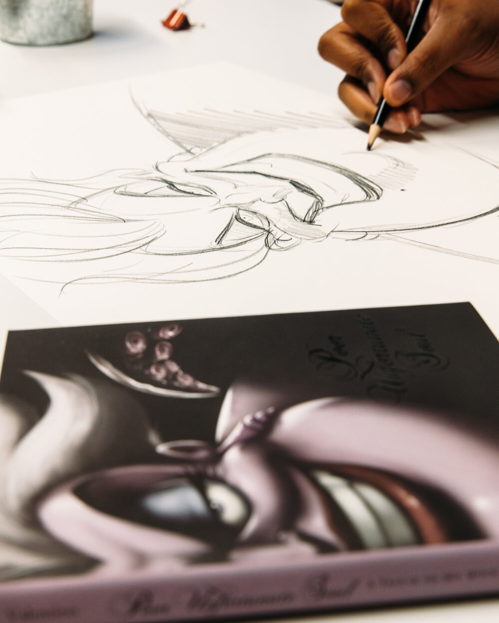  Disney Artist Jeff Thomas sketching his illustration of the cover of Poor Unfortunate Soul, a Disney Villains novel. 